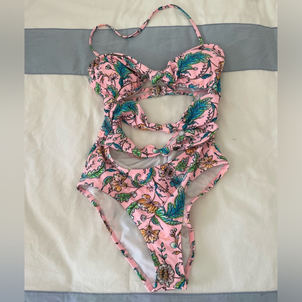 Pink swim with cutout knot details